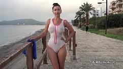 Wet transparent swimsuit in public